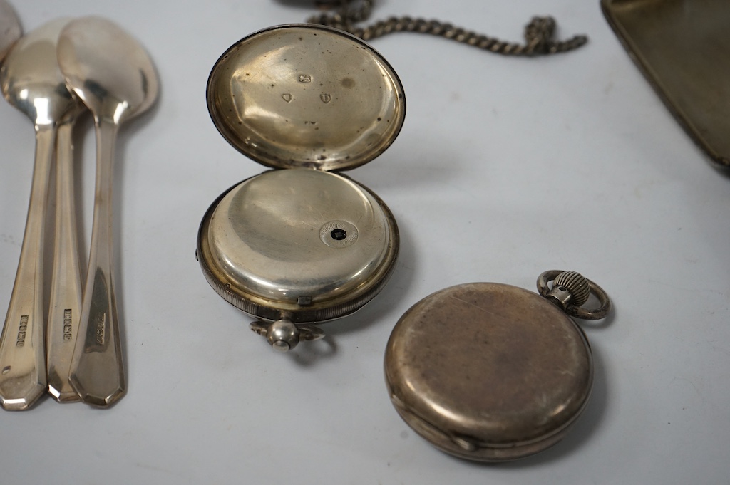 A set of six modern silver teaspoons, by United Cutlers Ltd, Sheffield, 1995, together with an earlier silver cigarette case and silver vesta case and two silver open faced pocket watches including J.W. Benson. Condition